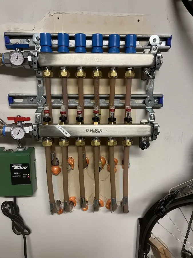 Plumber performing Water Heater Repair at a residential property in Island Lake